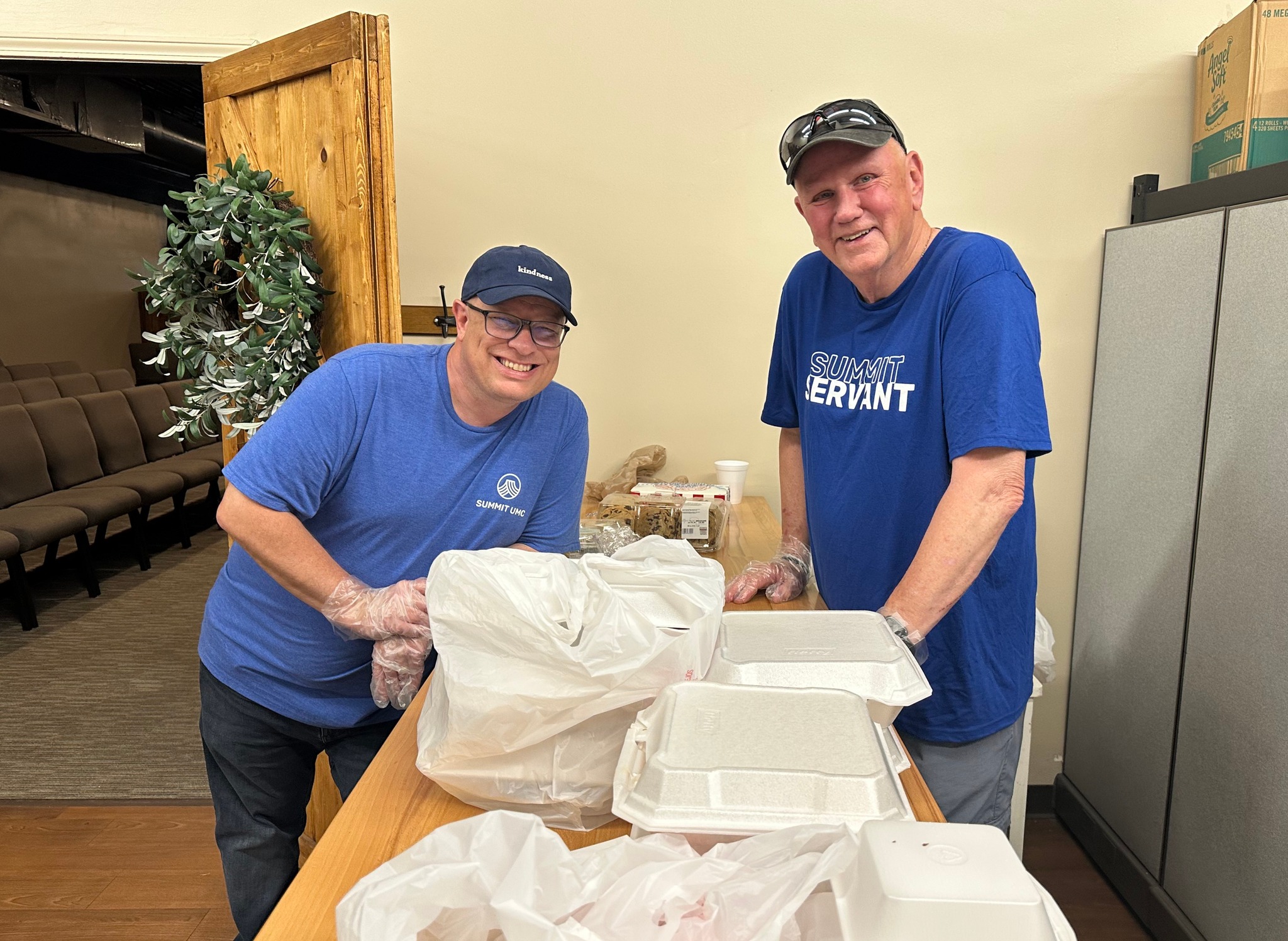 Volunteers packing community meals